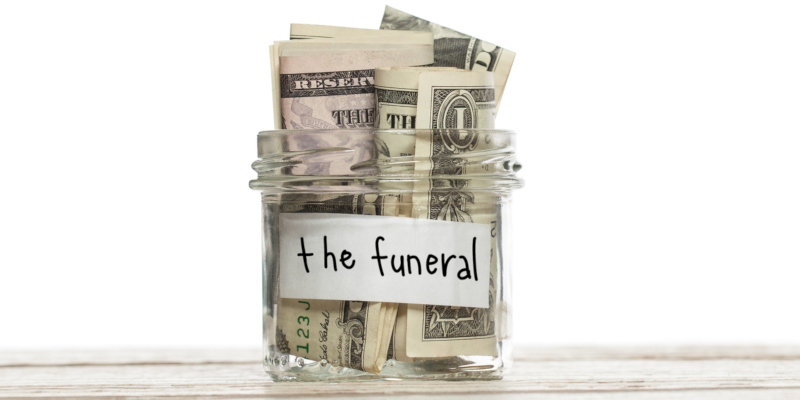 A jar full of money with a label the funeral