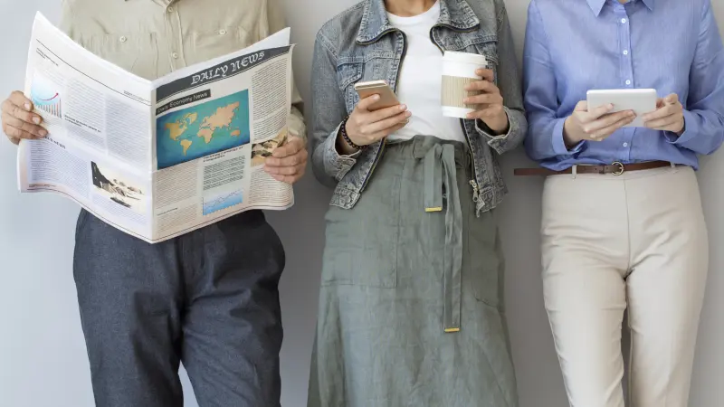 Coworkers standing near a wall